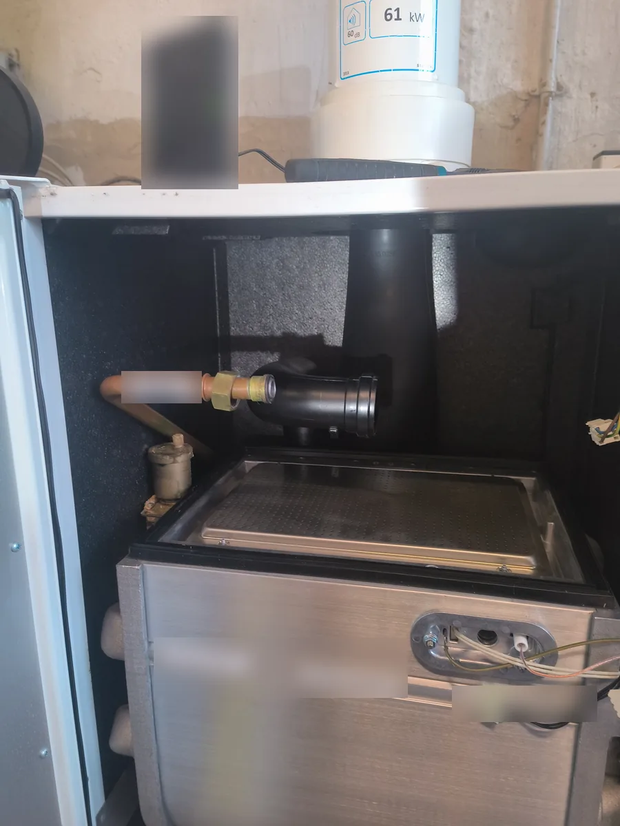 Commercial condensing boiler heat exchanger with the burner removed for cleaning and inspection in Haverhill