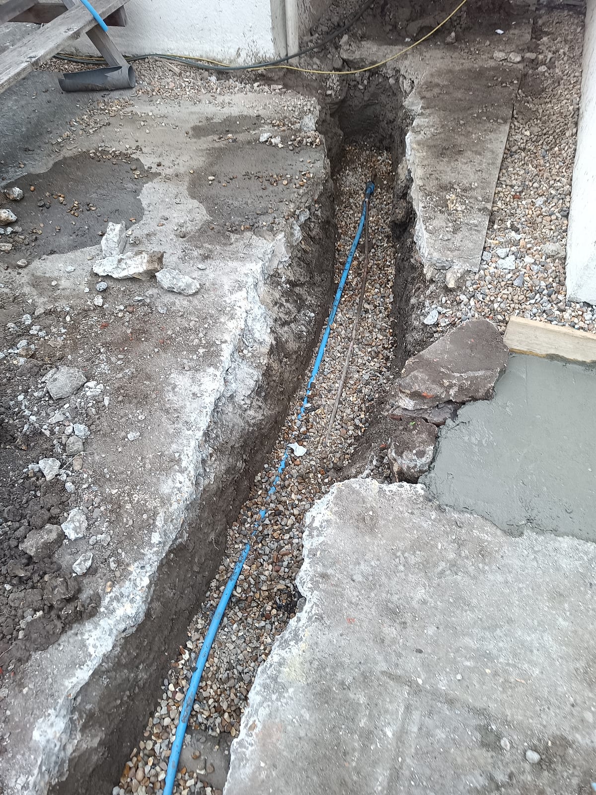 Open trench with blue water main