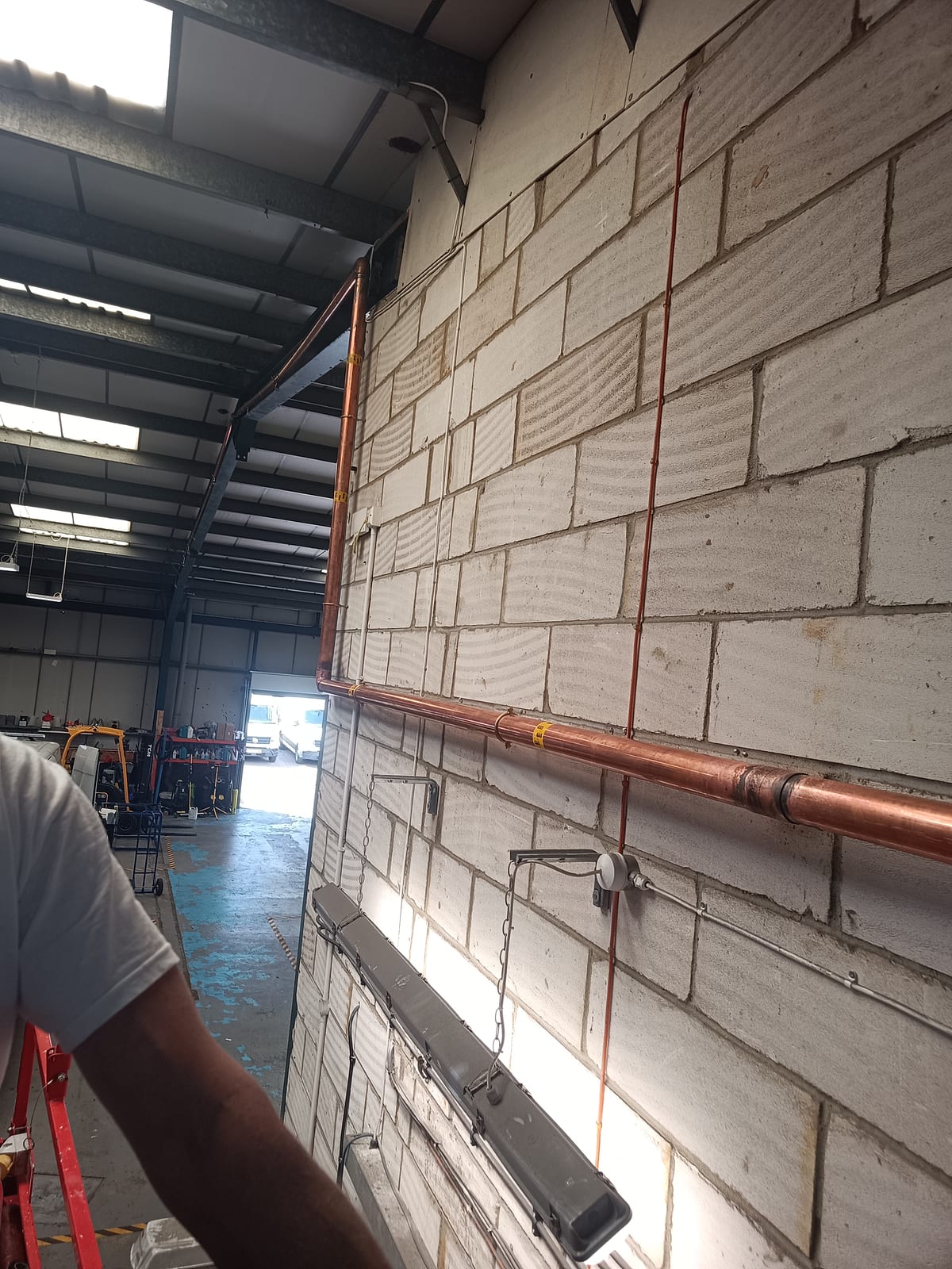 Workshop copper pipework toward bay door